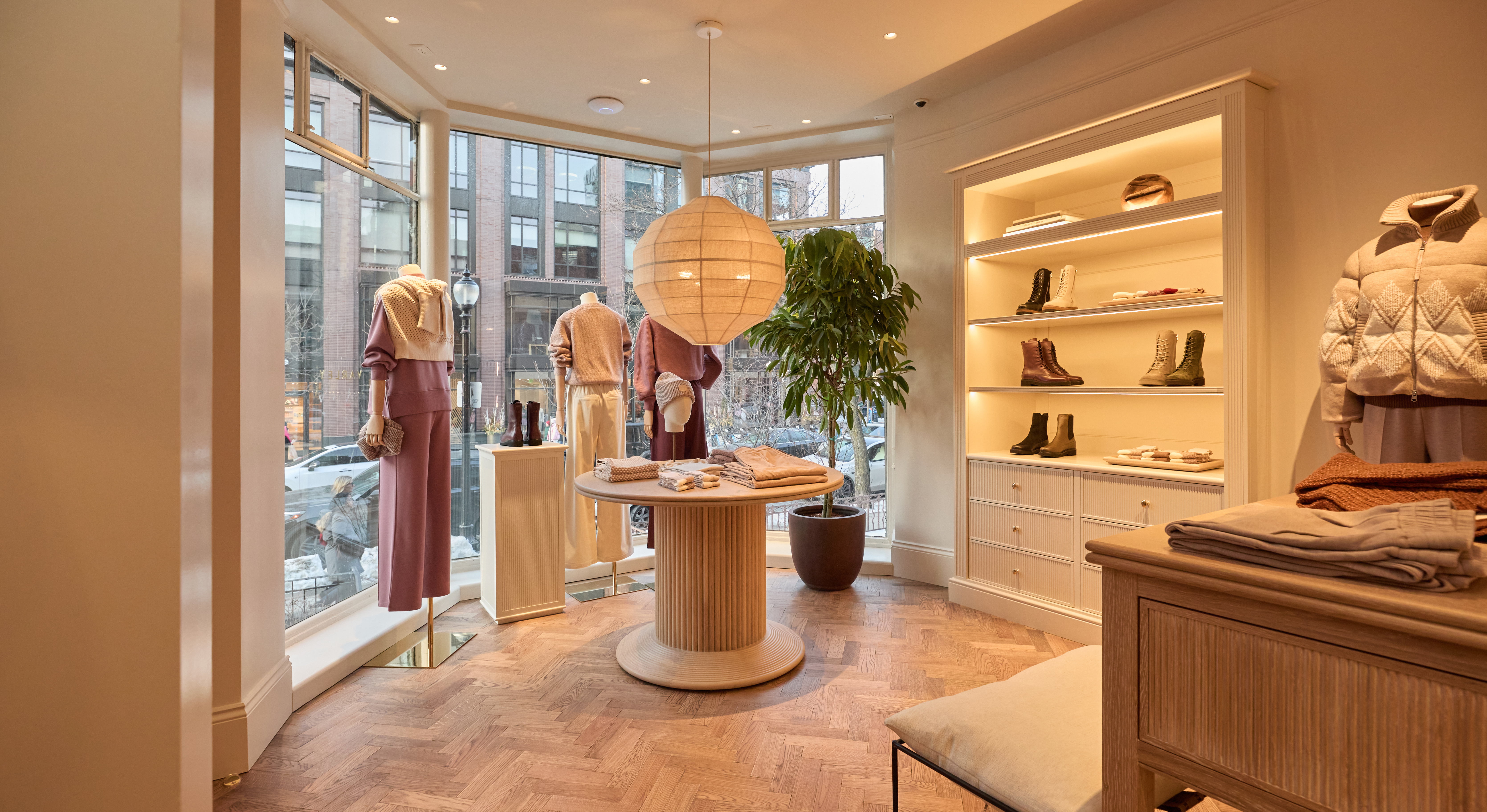 Varley retail store interior in Boston featuring integrated LED lighting, apparel displays, and warm modern retail design.